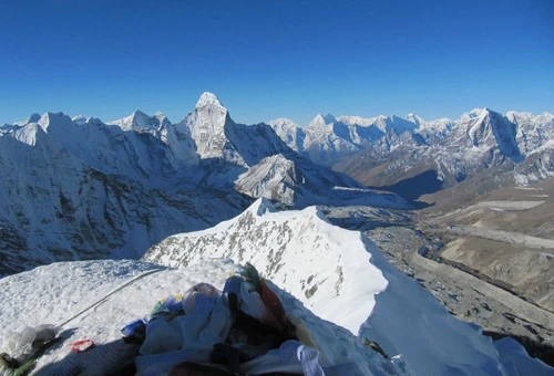 Climbers ascending beginner friendly 6000 meter peaks in Nepal including Island Peak Mera Peak and Lobuche East in the Himalayas