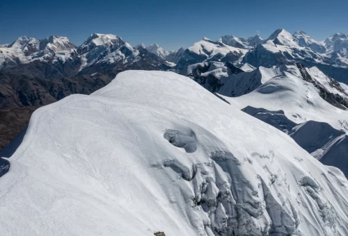 Chulu East and Chulu Far East peaks rising above the Annapurna region with snowy ridges and clear Himalayan sky