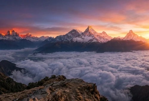 Beautiful sunrise over the Himalayan mountains in Nepal with golden light touching snow-covered peaks