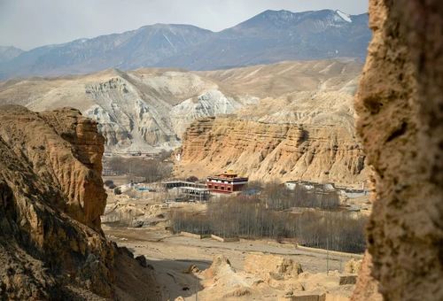 Upper Mustang Trek in Nepal featuring the ancient walled city of Lo Manthang surrounded by dramatic Himalayan desert landscapes.