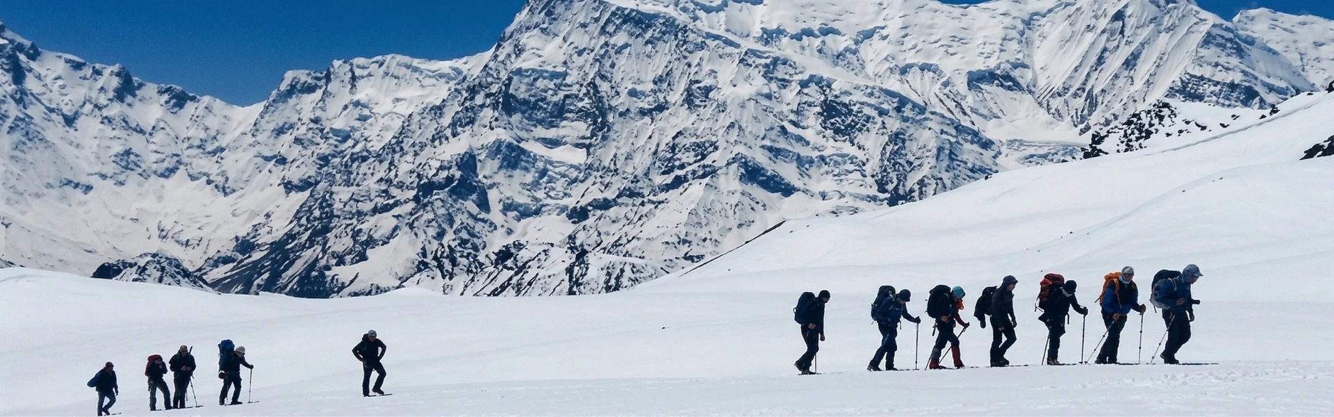 Climbers approaching Chulu East and Chulu Far East base camps with panoramic views of the Annapurna mountain range