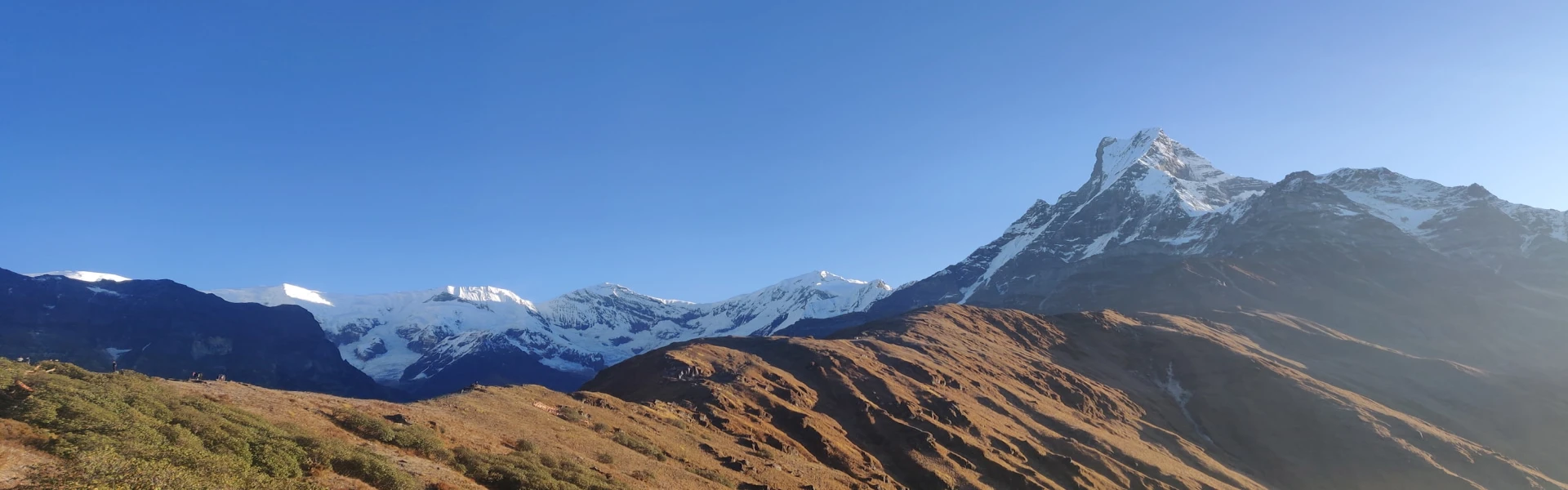 Trekkers talking with Nepali villagers in the Annapurna region