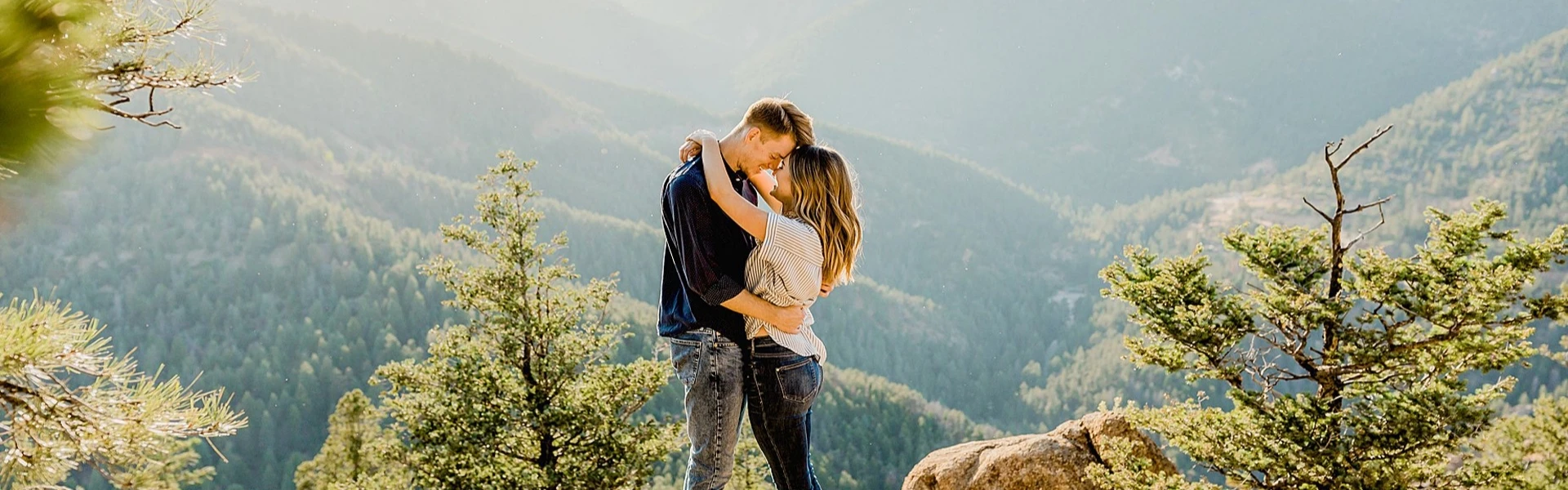 Romantic couple trekking toward Everest Base Camp with breathtaking Himalayan mountain views in Nepal.