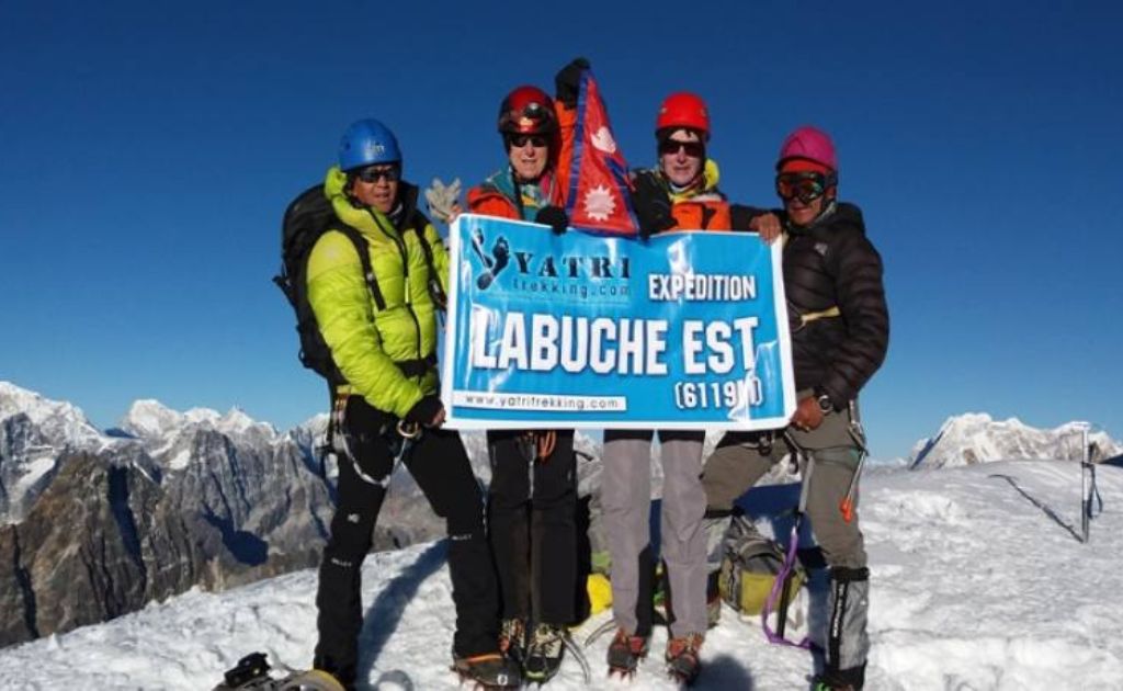Climbers ascending Lobuche East Peak after visiting Everest Base Camp in the Khumbu region