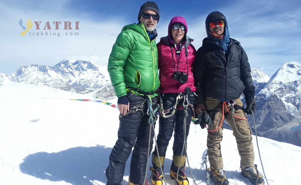 Climbers with guides reaching the summit of Mera Peak, the highest trekking peak in Nepal