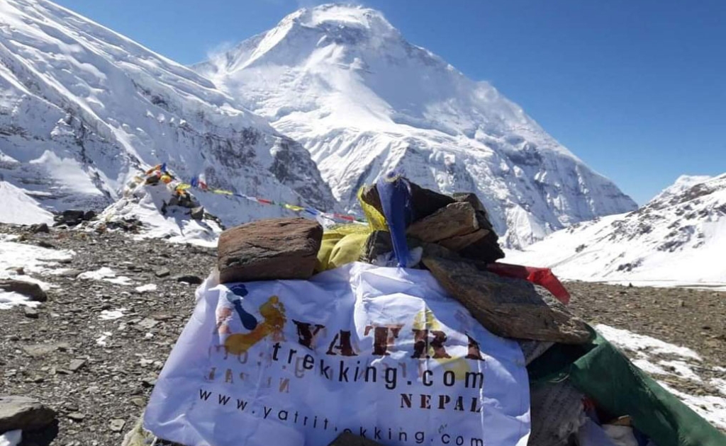 Snow-covered peak of Mount Dhaulagiri rising prominently above the Himalayan landscape