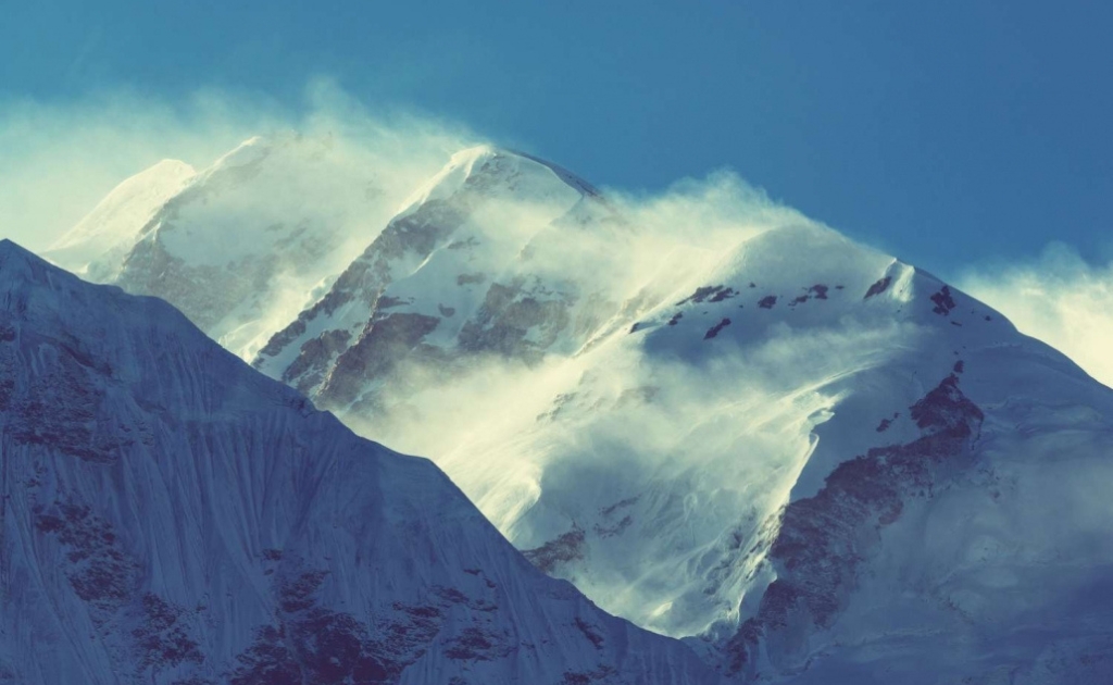 Snow-covered peak of Mount Kanchenjunga rising above the Himalayan landscapeSnow-covered peak of Mount Kanchenjunga rising above the Himalayan landscape