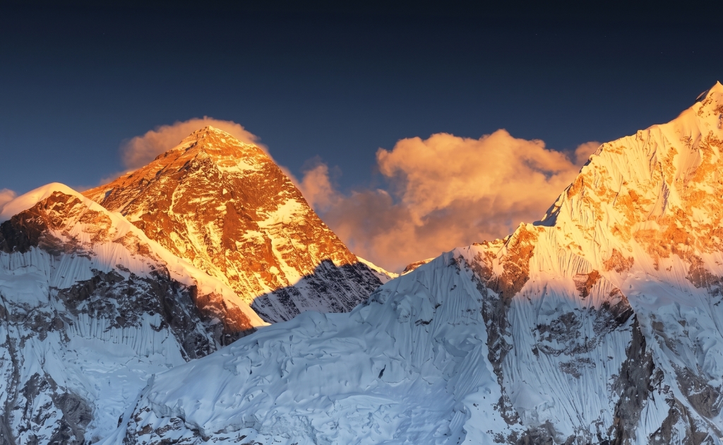 Sunrise over Mount Everest from Kala Patthar viewpoint with golden light on Himalayan peaks