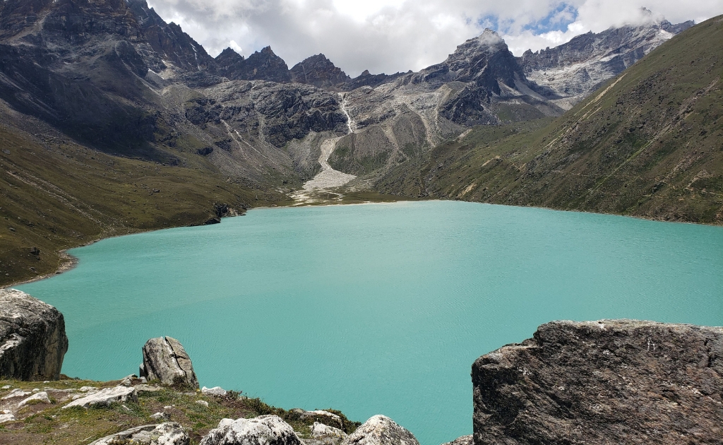 Aerial view of the turquoise Gokyo Lakes in Nepal's Khumbu region surrounded by rugged Himalayan landscapes.
