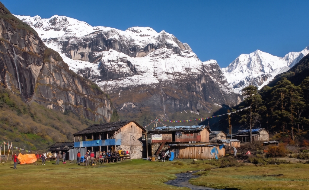 Local villagers in traditional clothing along the Kanchenjunga trekking route in eastern Nepal.