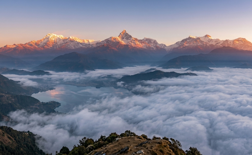 Sunrise over Annapurna range from Sarangkot viewpoint with Machapuchare peak glowing in golden light