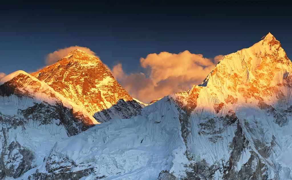 Mount Everest glowing at sunrise from Kala Patthar viewpoint with surrounding Himalayan peaks