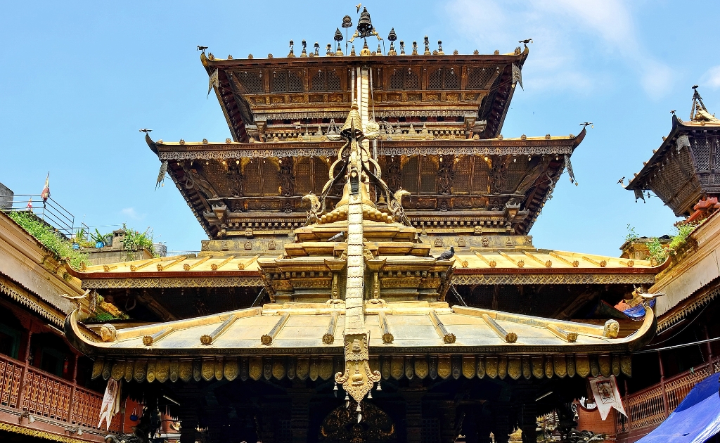 Golden Temple (Hiranya Varna Mahavihar) decorated with intricate carvings and prayer wheels in Patan.