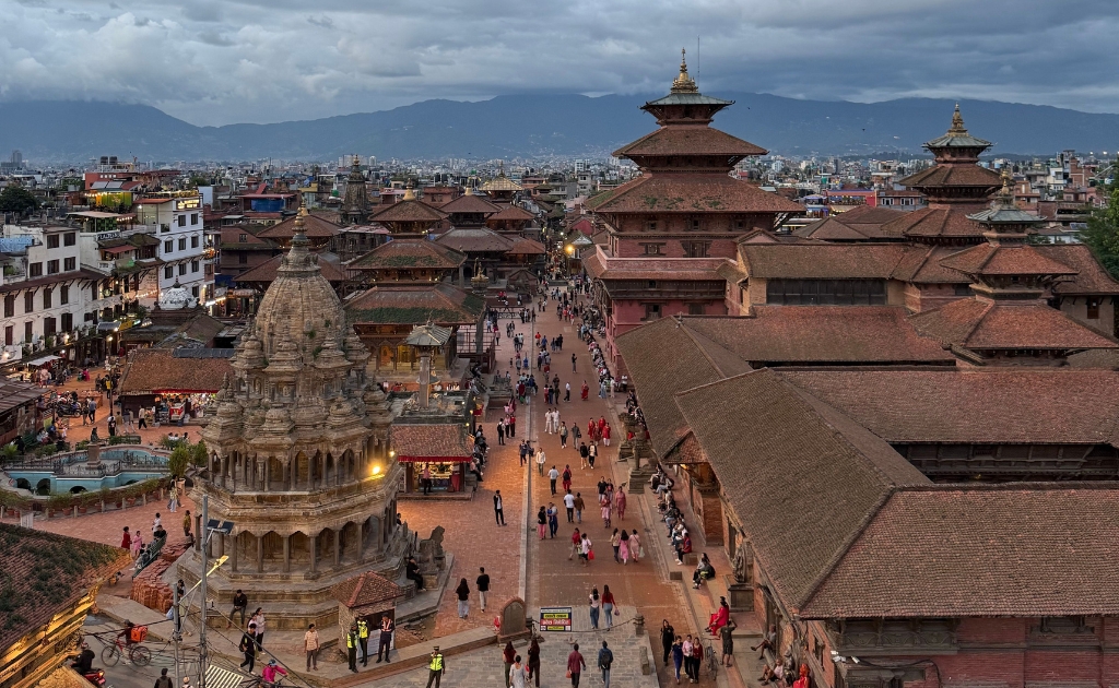 Rooftop cafe overlooking Patan Durbar Square and its historic temples.